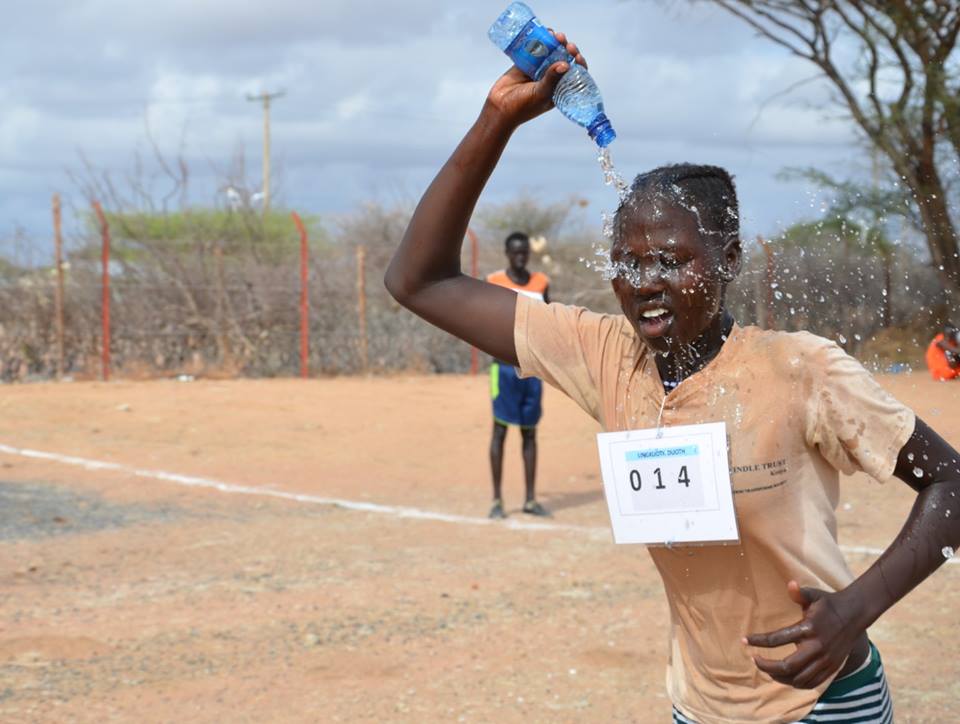 A young refugee athlete cooling off during the race UNHCR/A.Nasrullah