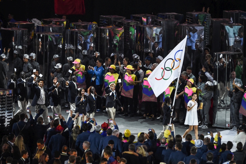 Rose Lokonyen carries the Olympic flag and leads the Refugee Olympic Team during the Opening Ceremony of the 2016 Games in Rio.