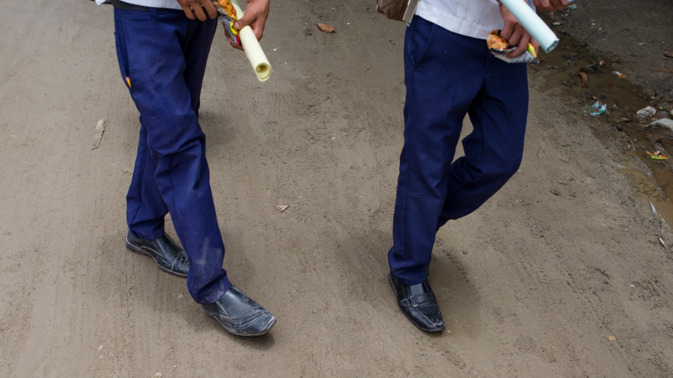 Students walk home from school in the community of 6 de Mayo in San Pedro Sula, Honduras. Local schools have become a recruiting ground for street gangs.