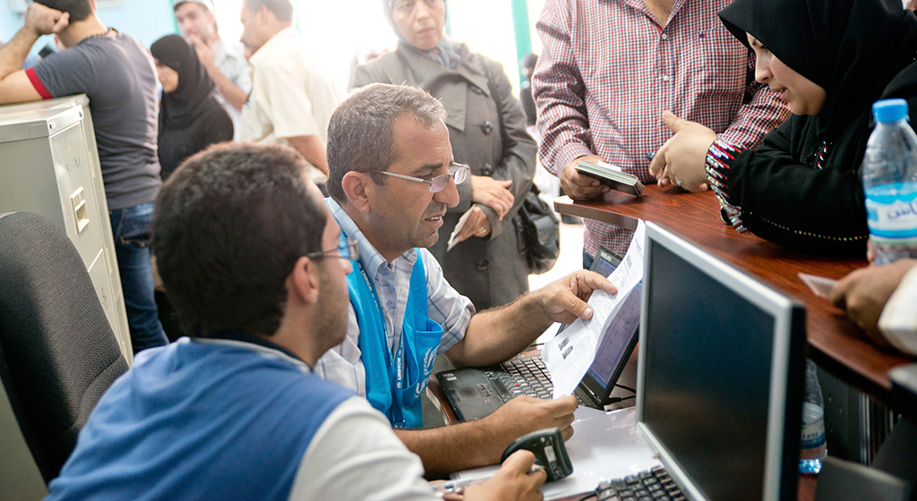 With approximately 75% of Jordan's refugee population living in urban settings, help desks like this one provide critical information and services to refugees in areas of protection, health, and registration. © UNHCR/Jared J.Kohler