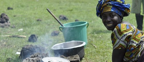 Uganda/ many refugees who managed to flee with some of their possession from eastern DRC are cooking for themselves in Nyakabande transit centre is south west Uganda. This woman managed to make her own stove out of volcanic rocks she found in and around the transit centre. Nyakabande is in the shadows of a number of volcanoes that straddle Uganda, Rwanda and the DRC and volcanic rocks are plentiful./ UNHCR/ L. Beck/ November 2013