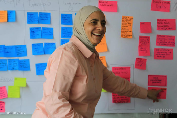 Rana Dajani, director of We Love Reading, brainstorms ideas during the Amplify Refugee Education Challenge design bootcamp