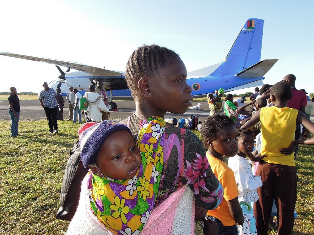 Young Angolan refugee woman with a child
