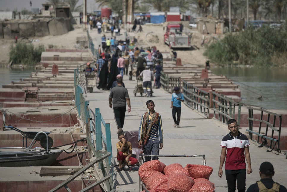 The floating bridge at Bzeibiz, Iraq, is a lifeline for displaced people seeking safety and work in Baghdad.