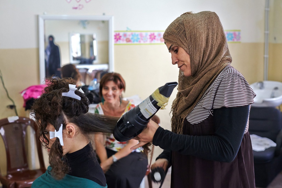 Hoping to build her skills and secure a job, a Syrian refugee learns hairdressing at the Women's League in Halba, Lebanon.