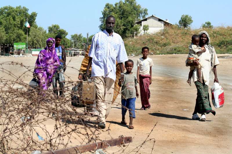 Somali refugees and migrants cross from Somaliland into the no-man's land between Somaliland and Djibouti.