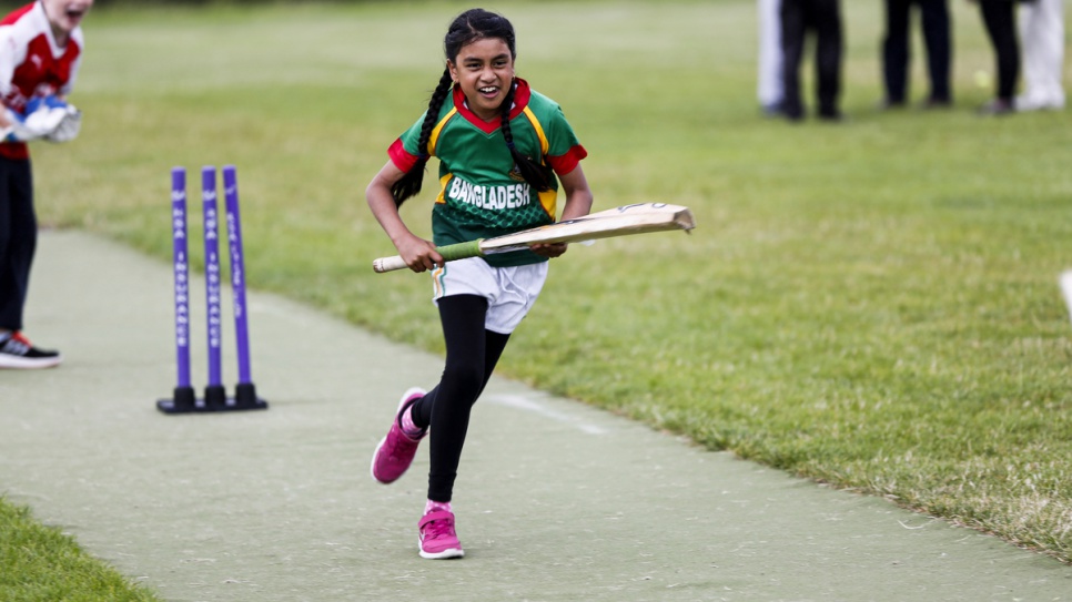 Wearing the Bangladesh cricket shirt, a young girl runs for the line in the hopes of scoring a point at the Carlow Cricket Club.