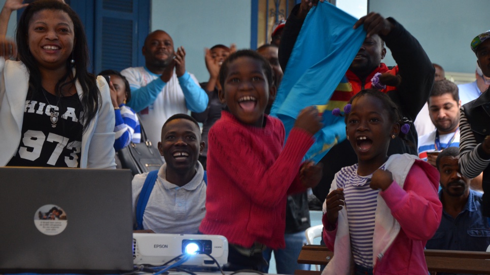 Refugees from Democratic Republic of the Congo celebrate as Team Refugees compete at the Rio Olympics.