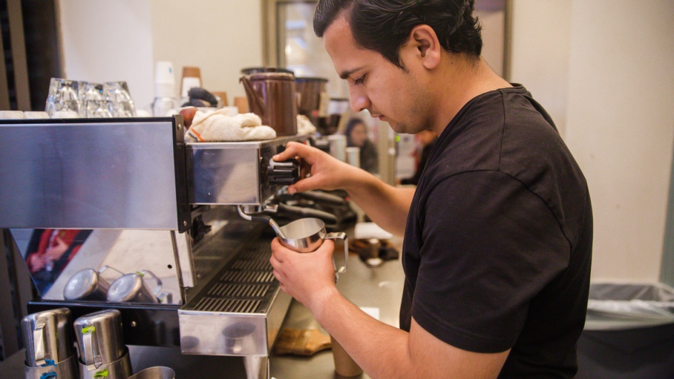 Samiullah Haidari, a refugee from Afghanistan, works his shift at Blue Bottle Coffee in San Francisco.