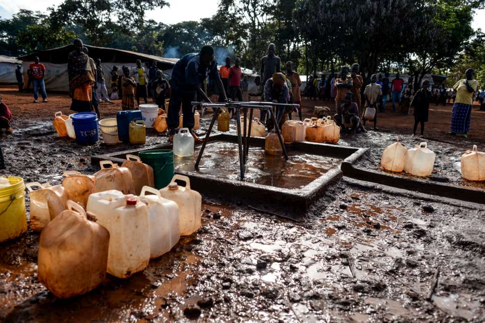 Refugees collect water at Nduta camp, which is located in Tanzania's North West Province and can barely provide enough shelter, household items, latrines and showers.