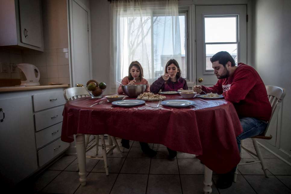 Kevork and his sisters eat lunch at their home. Most weekends, the three skip a meal during the day.
