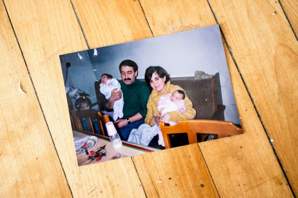 An old picture of Kevork's parents on the floor of his new home in Laval, Quebec. They are still in Lebanon waiting to be resettled.