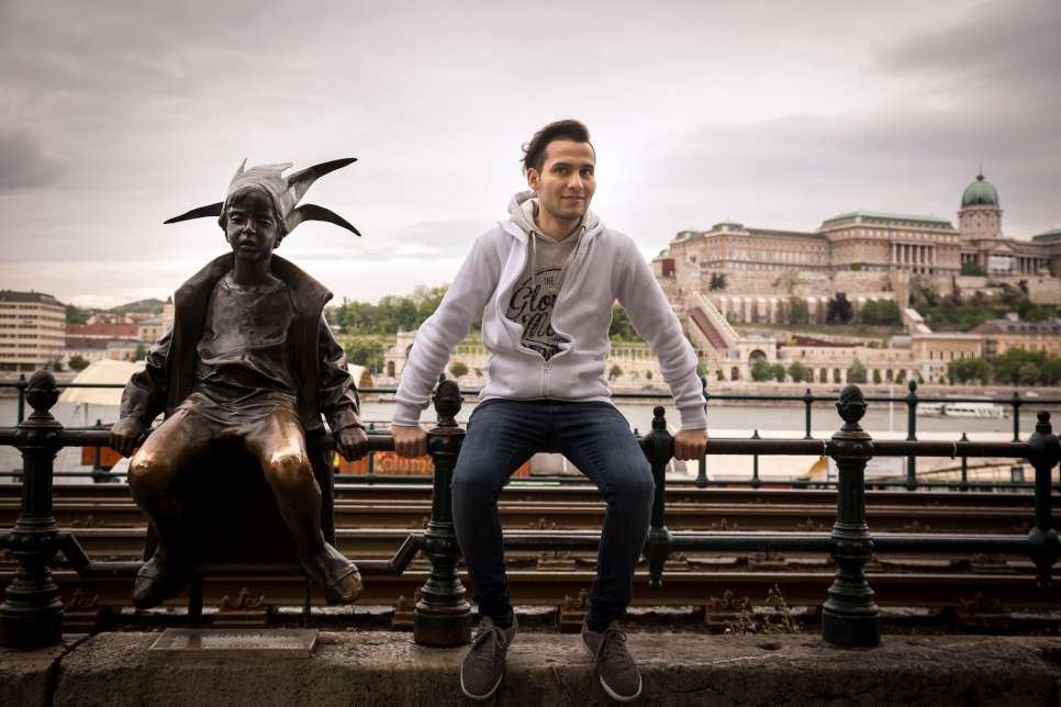 Mohamad visits the Little Princess statue, a well-known landmark in Budapest.