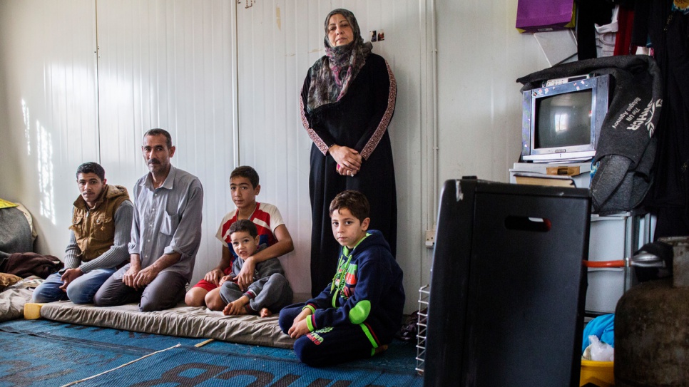 Mohammad Lakash with his family at their caravan in Za'atari refugee camp in Jordan.