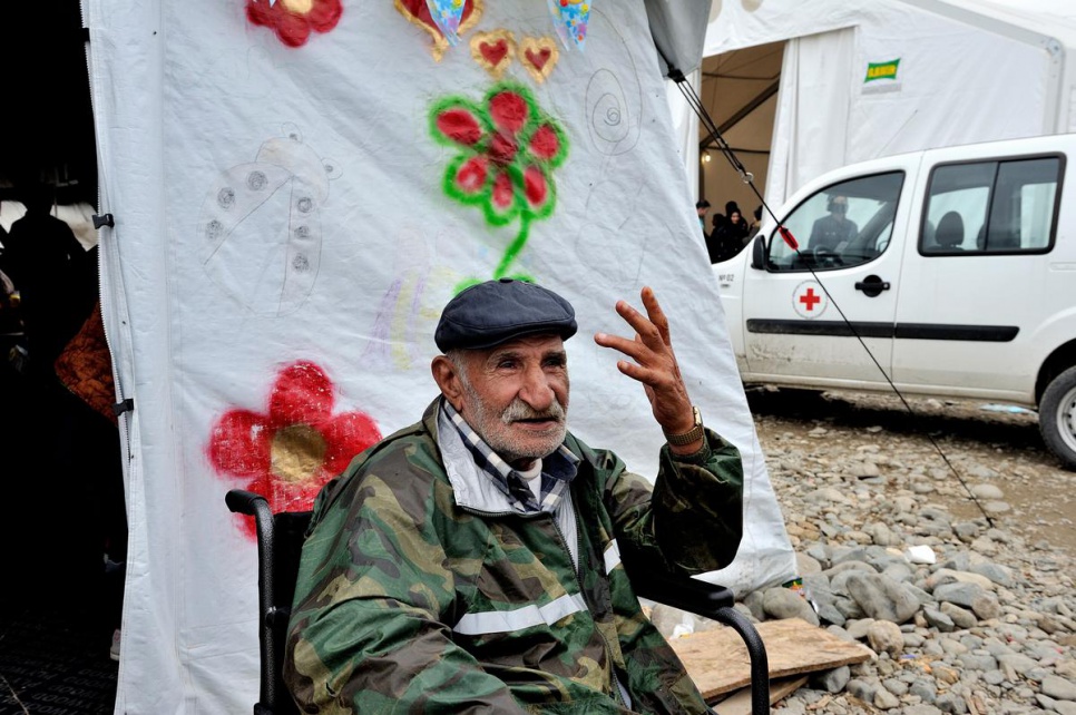 Ismail, an 80-year-old refugee from Syria, sits in his wheelchair outside a tent at Vinojug reception centre in the former Yugoslav Republic of Macedonia. He is waiting for the rest of his family, which includes 23 people spanning three generations. The family will receive food, clothing and medical help.