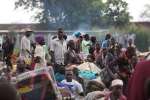 Recently arrived refugees from South Sudan wait at the UNHCR Elego col...