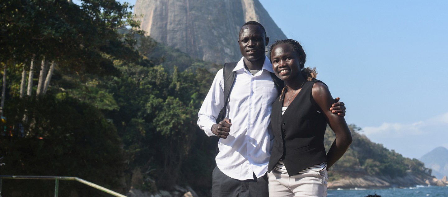 Athletes Paulo Amotun Lokoro and Rose Nathike Lokonyen enjoy the beach in Rio de Janeiro, Brazil. It was the first time either had seen the ocean.  © UNHCR/Benjamin Loyseau