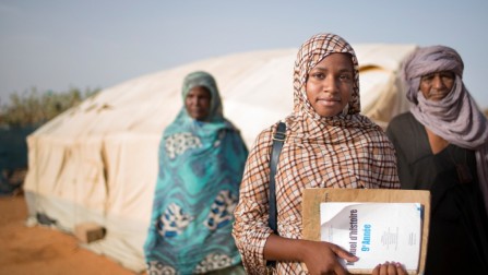 Malian refugee Tinalbarka, 16, with her parents as she leaves the family tent to attend classes at secondary school in Mbera refugee camp in Mauritania.  UNHCR/Agron Dragaj