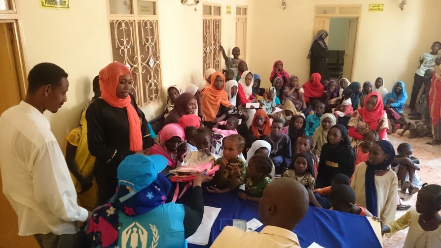 A joint distribution of school uniforms by UNHCR and Sudan’s Commissioner for Refugees (COR) to refugee children from the Central African Republic (CAR). ; Over 1,400 refugees from CAR are hosted by Sudan in South Darfur State (July 2016).