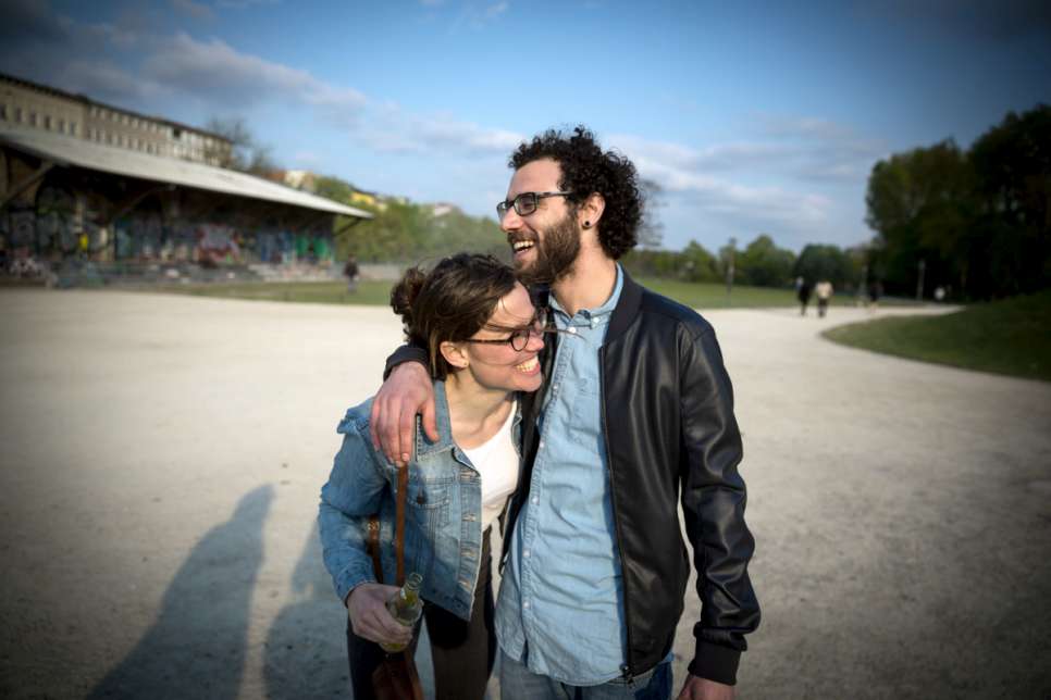 Syrian Palestinian Ramy, 25, and Berlin local Antonia, 28, take a walk through Görlitzer Park.