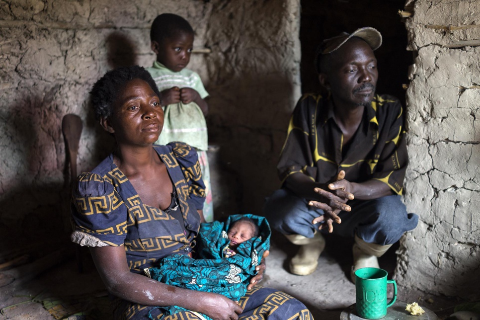 Kabulo Ilunga cradles her grandson, Kabila, just three hours after his birth at the family's shelter in Kanteba IDP site, Katanga Province, DRC. Kabulo's family fled their home village to escape Mai Mai Bataka Katanga rebels.
