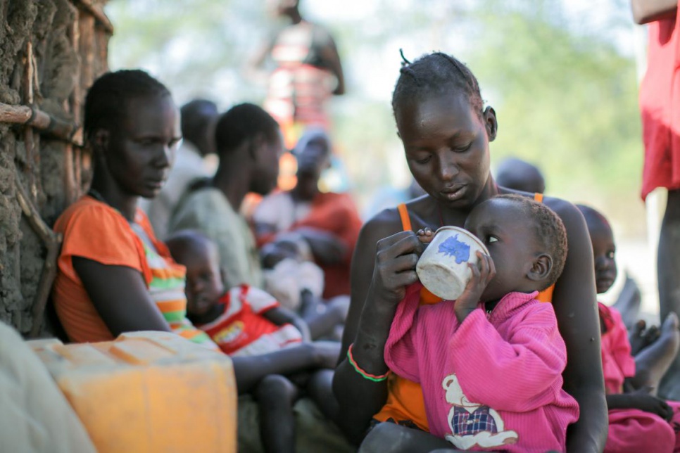 Two-year-old Nyanchau Teny drinks an infusion of neem tree leaves in Rumbek, South Sudan. Neem infusion is used to treat coughs, diarrhoea and vomiting.