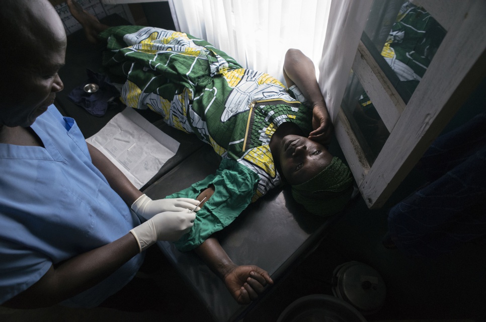 Mariana Nyirarukondo, 33, receives a contraceptive implant from Dr. Kalibongo Raymond as part of the family planning services offered at the health centre in Kitsule, DRC.