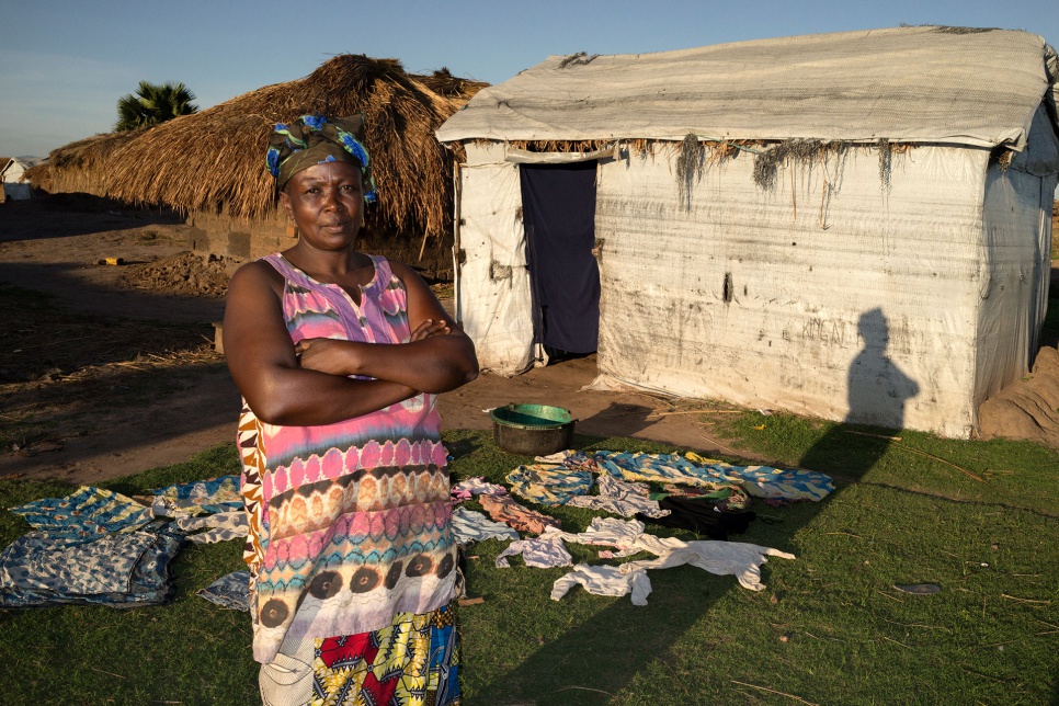Nine Essential Steps to Local Integration. Step 1: Say Goodbye to Your Plastic Shelter. Okenge Sakina, 50, stands in front of a shelter made of plastic sheeting in Lukwangulo, DRC.