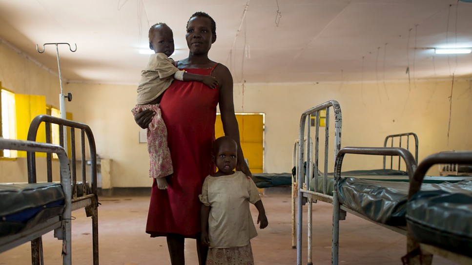 Cecilia Obere, 26, fled her home in Central Equatoria, South Sudan, with her twin daughters, Karleta and Lina (standing), when her community experienced severe food shortages.
