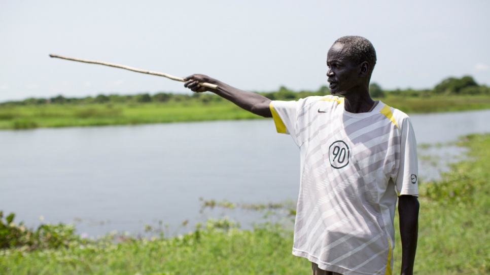 Gatluak Ruei Kon, 56, stands on his old farm in Old Akobo, in South Sudan's Jonglei State. He was separated from his family and his land for over two years after war broke out in 2013.