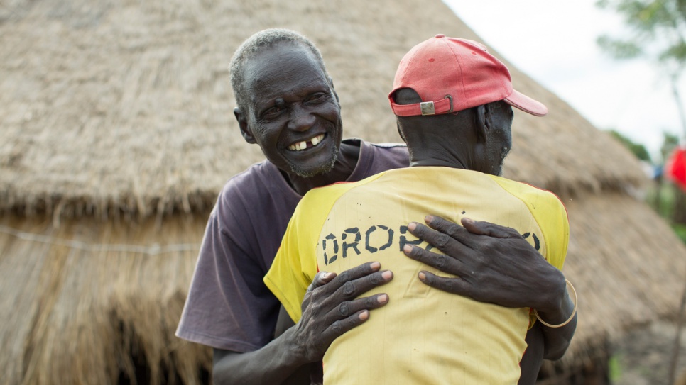 Gatluak Ruei Kon hugs a childhood friend, John Kuteia, in Akobo, South Sudan. "Everyone thought I was dead," he says. "When my friends learned that I had returned home, they all came to greet me."