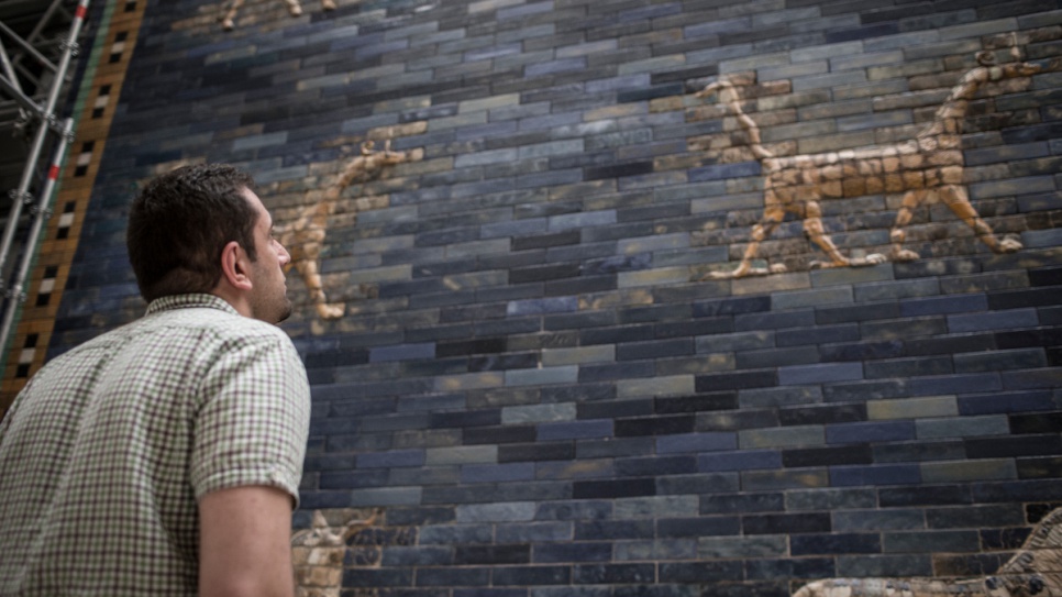 Syrian refugee Ahmad Moutad, 27, admires the ancient Babylonian Ishtar Gate, part of the collection at Berlin's Museum of the Ancient Near East.