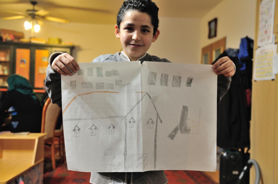 Bashar, 12, with one of his drawings in his new home in Gänserndorf.
