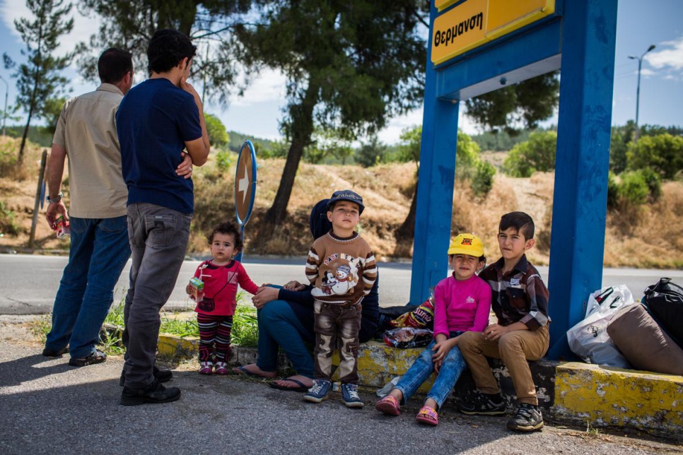 A family from Sinjar in Iraq wait for nightfall at a petrol station in Evzonoi, in northern Greece. Refugees often cross at night, making them more vulnerable to attacks by criminal gangs.