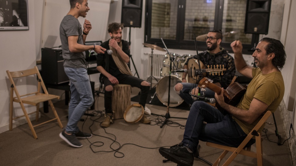 Musiqana band members Abdallah Rahal, Ali Hasan, Alaa Zaitouna and Adel Sabawi share some jokes during rehearsals.