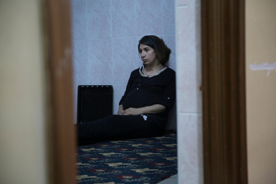 Shadiya, a Syrian refugee sits in the kitchen after a Ramadan iftar. "Everything we make is exactly what we would make at home," she says.