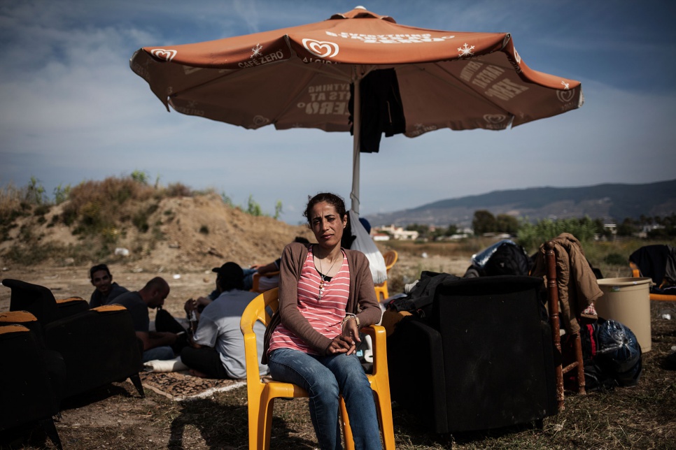 Nasreen sits outside the defunct Captain Elias Hotel in Kos, Greece, where she and other Syrian refugees have found temporary shelter.