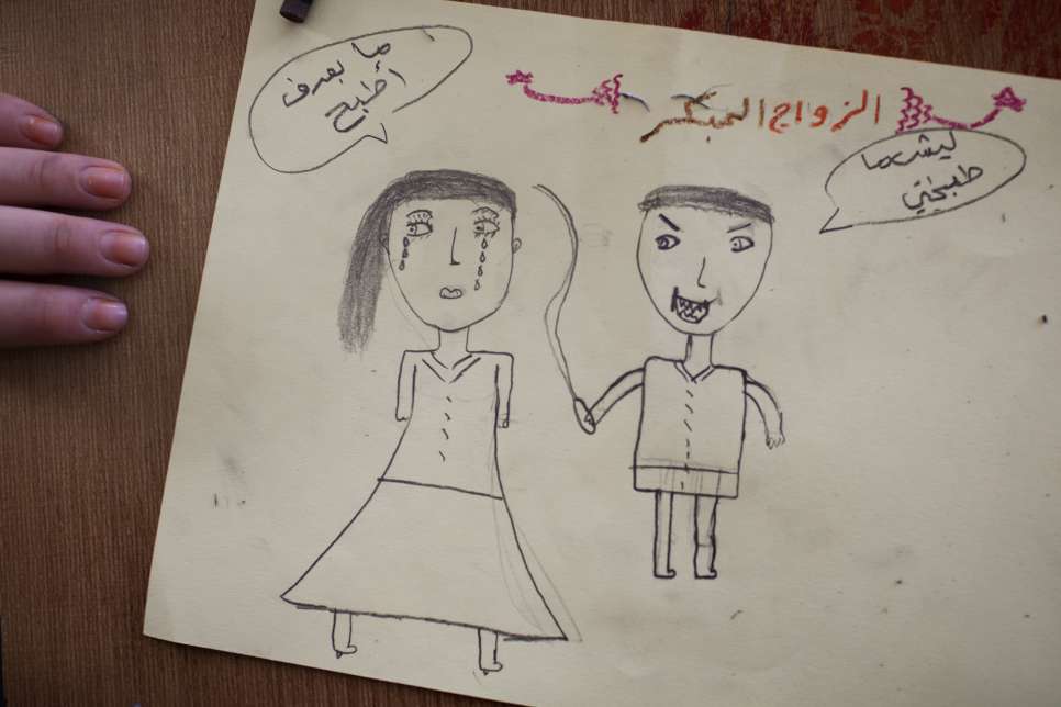 A teenage girl draws a husband hitting his teenage wife for not being able to cook at one of Omaima's classes.