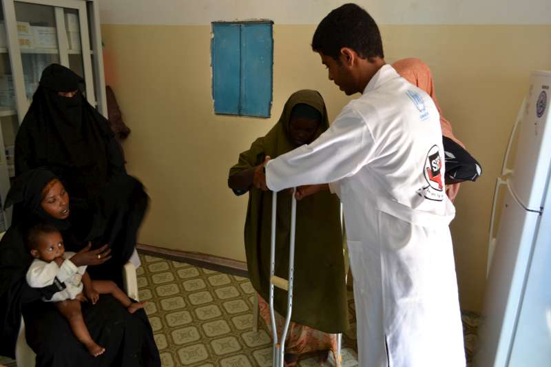 A doctor sees patients at the Mayfa'a Reception Centre.