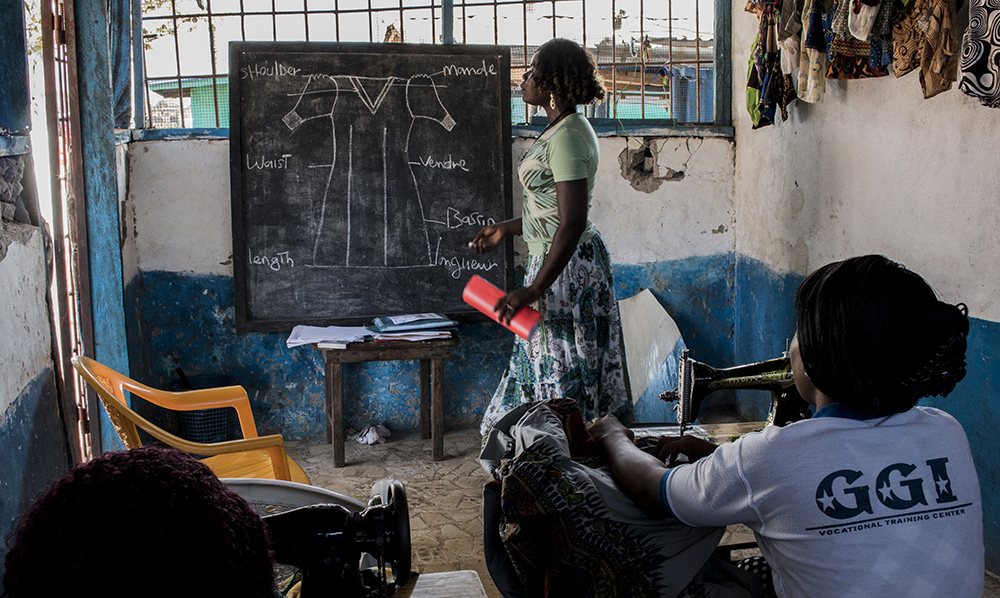 Liberia. Irene teaches the basics of making dresses for women