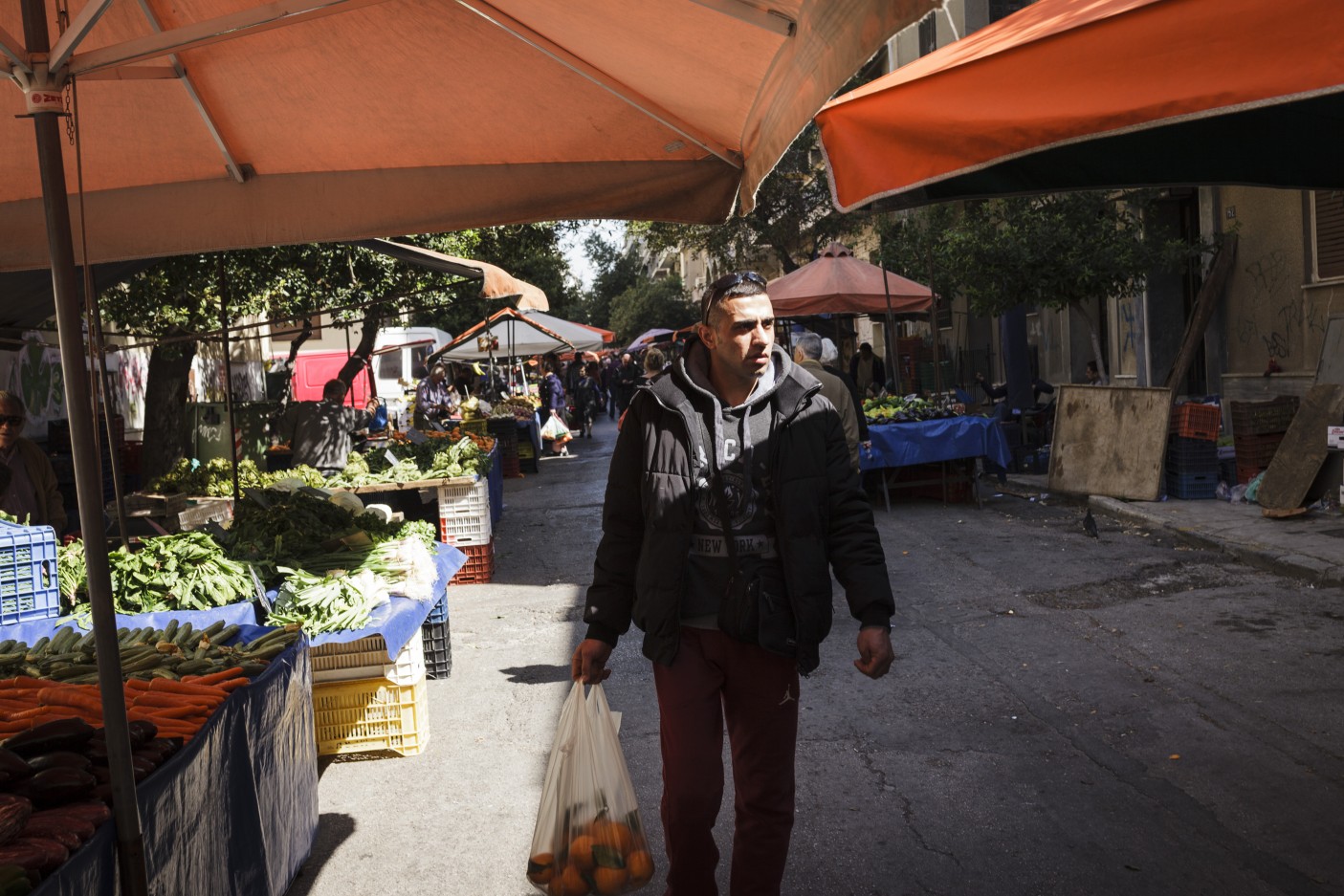 Greece. Syrian refugee carries the Olympic flame in Athens