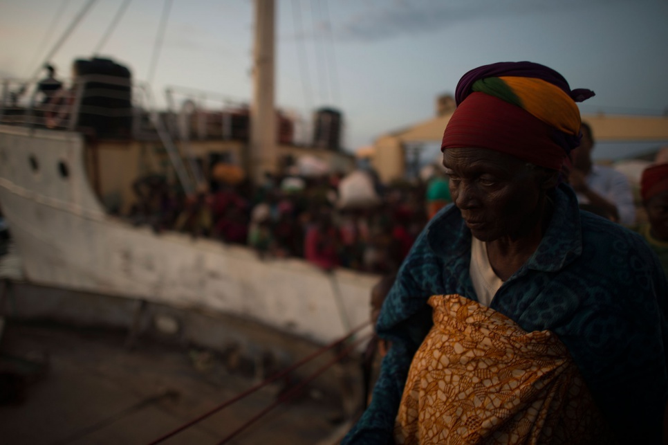 Foibe's mother, Elizabeth, steps off the MV Liemba, the ferry that took them from Kagunga Peninsula to Kigoma in Tanzania.