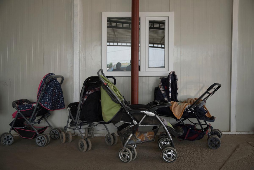 Strollers line the front entrance of the maternal health clinic at Domiz refugee camp. Many Syrian refugees in the region feel Iraqi public hospitals are not an option for them.