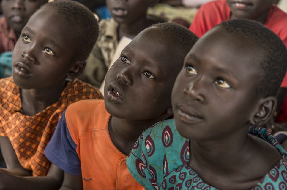 Refugee children from South Sudan pay close attention at Alaak's school in Nyumanzi refugee settlement.
