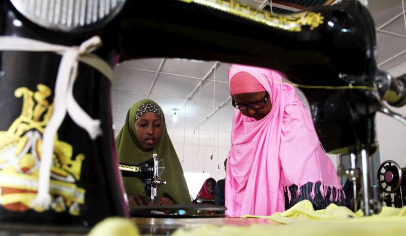 A tailoring class at the GECPD centre in Galkayo, Somalia. Displaced women are particularly vulnerable and have often been victims of domestic violence and rape. The skills training gives them hope for a better future. 