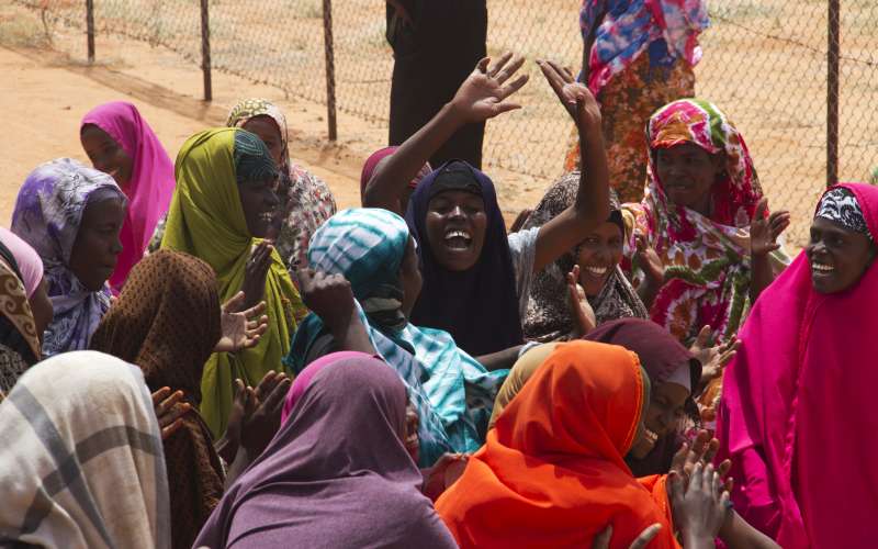 Mothers of the winning soccer team celebrate their sons' triumph. 