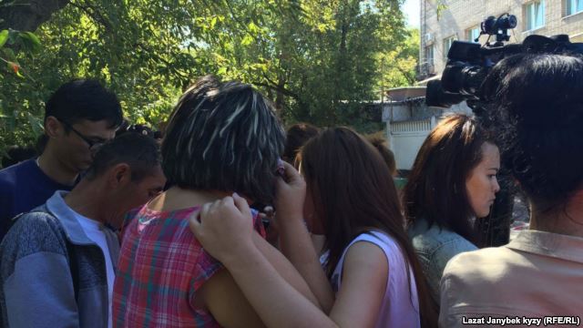 People gather outside the site of the fire in northeast Moscow.