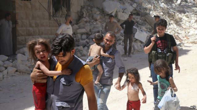 Syrian men carry injured children amid the rubble of destroyed buildings following air strikes on a rebel-held neighborhood of Aleppo.