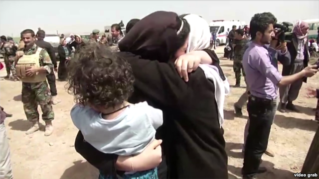 Yazidis receive aid in Kirkuk after they were released by Islamic State militants.