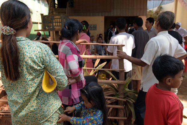 Cambodian villagers gather to give blood samples during a screening for HIV in Kandal province on Feb. 22, 2016.